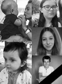 a black and white photo of a family with a baby